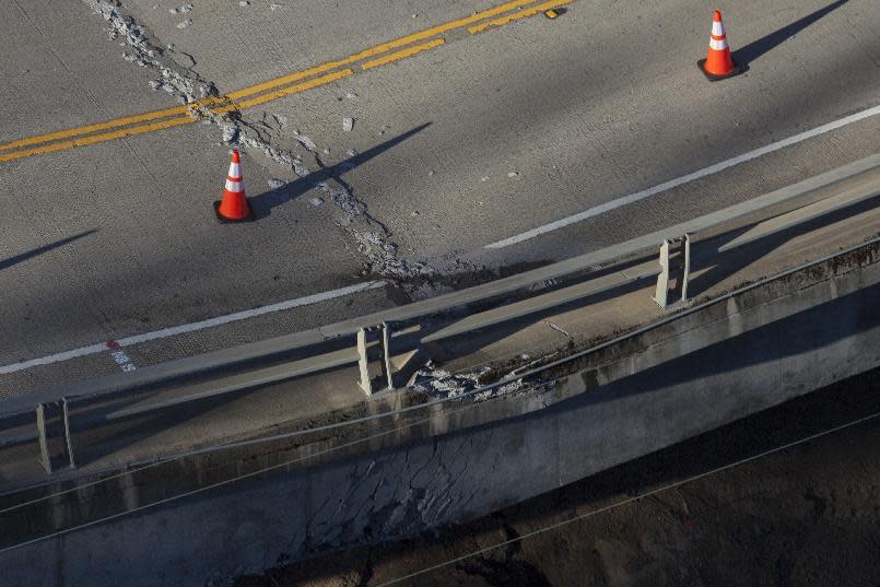 Damage to the Pfeiffer Canyon Bridge on Highway is seen from a helicopter on Monday, March 13, 2017, in Big Sur, Calif. The downed bridge along the California coast has split the Big Sur area in two, stranding residents without access to grocery stores and public services and closing part of scenic Highway 1 for as long as a year. (AP Photo/Nic Coury)