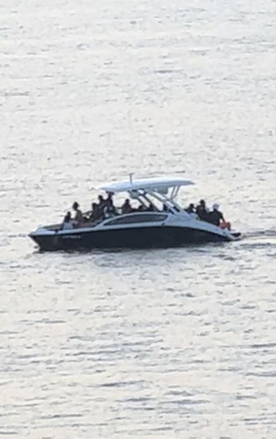 Sabbatia Lake resident Mary Beth Perry took this photo of a boat ferrying in visitors to Sabbatia's island in Taunton on Saturday, Aug. 5, 2023.
