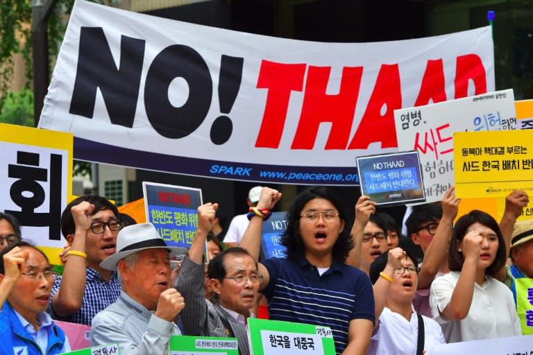 South Korean activists rally against the plan on deployment of the US-built Terminal High Altitude Area Defense (THAAD) system in the country, outside the US embassy in Seoul, on July 11, 2016