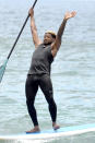 <p>The smooth singer did a balance check while paddleboarding during a Hawaiian vacation with friends. (Photo: BACKGRID USA) </p>