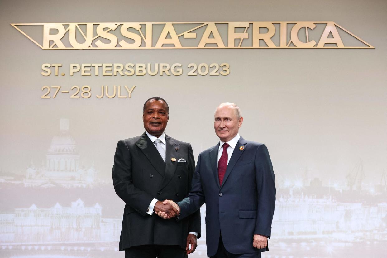 Russian President Vladimir Putin greets Congolese President Denis Sassou Nguesso (TASS Host Photo Agency/AFP via G)