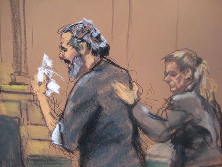 Egyptian Adel Abdul Bary, 54, is consoled as he wipes away tears while facing U.S. District Judge Lewis Kaplan (not pictured) in a Manhattan court in New York on September 19, 2014, in this courtroom sketch. REUTERS/Jane Rosenberg