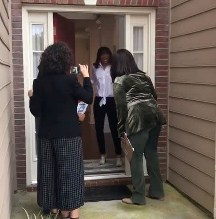 Oprah Winfrey greets a resident during a trip to Georgia to help canvas for Democratic gubernatorial candidate Stacey Abrams, Georgia, U.S., November 1, 2018, in this still image taken from video obtained from social media. @oprah/via REUTERS