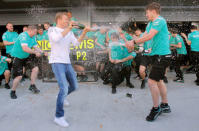 Formula One - Russian Grand Prix - Sochi, Russia - 1/5/16 - Mercedes F1 driver Nico Rosberg of Germany celebrates his victory with the team. REUTERS/Maxim Shemetov