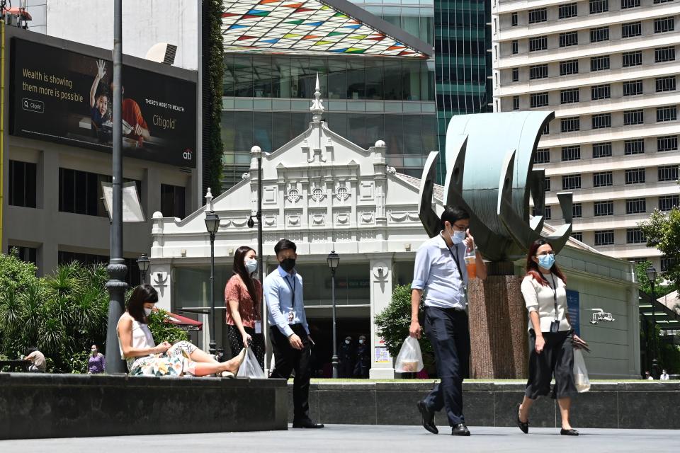 Singapore asks firms to hire locals amid foreigner shortage.  (PHOTO: ROSLAN RAHMAN / AFP) 