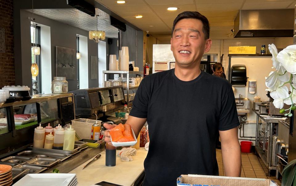 New Omakase Manager Han, a native of South Korea, displays a fresh cut of fish Friday, Oct. 13, 2023, at the downtown Rockford sushi restaurant.