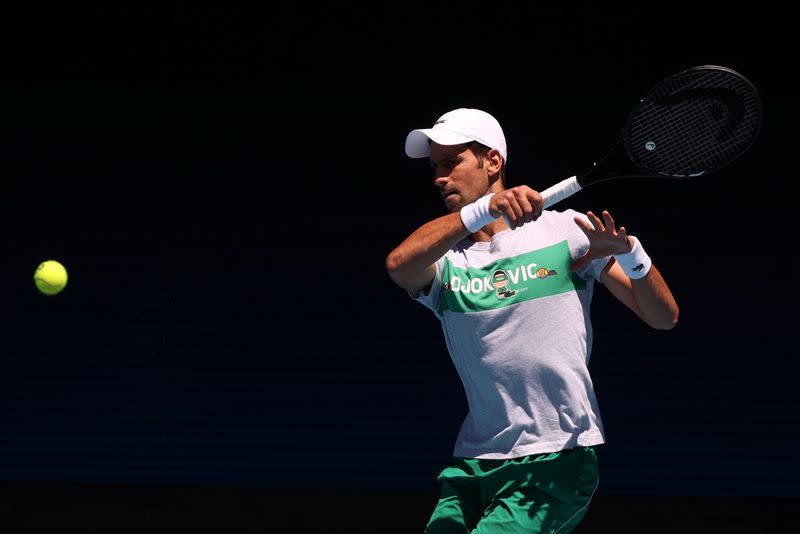 FILE PHOTO: Serbia's Novak Djokovic practices at Melbourne Park in Melbourne