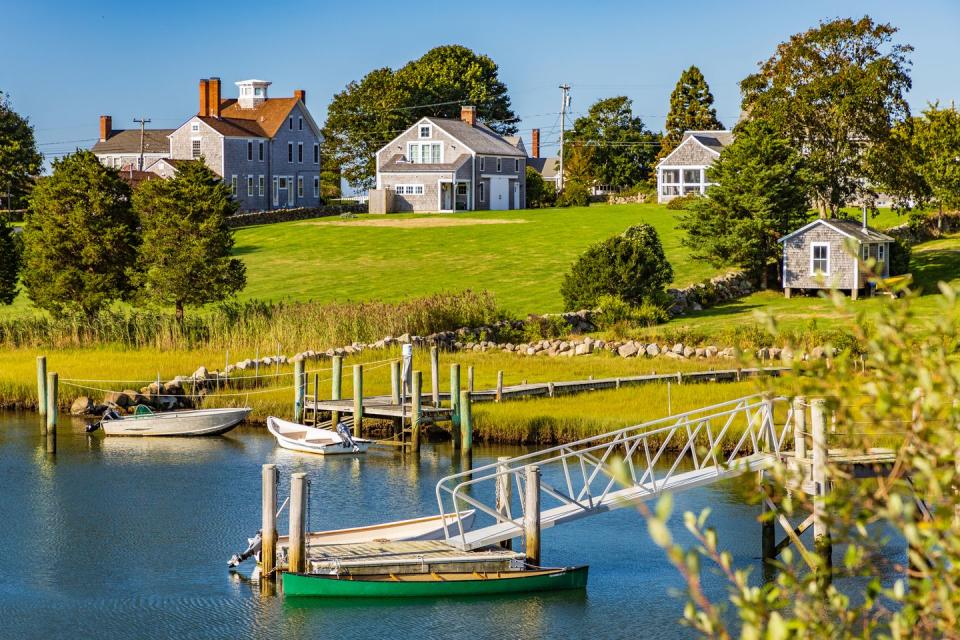 scenic view of river by buildings against sky,westport,massachusetts,united states,usa
