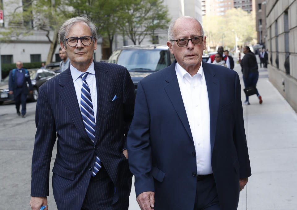 Former Rochester Drug Co-Operative CEO Laurence Doud III, right, leaves US. District Court in Manhattan with his attorney Robert C. Gottlieb, Tuesday, April 23, 2019, in New York. Prosecutors allege Doud ignored red flags to turn his drug distributor into a supplier of last resort as the opioid crisis raged. (AP Photo/Kathy Willens)