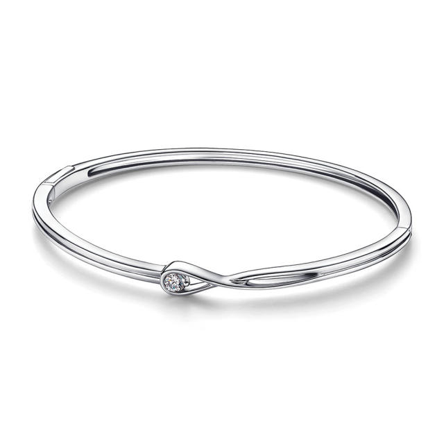 Diamonds by Pandora This sculpted Brilliance bangle in sterling silver is accented with a single lab-created diamond totaling .15&#x00202f;carats. Rosario Dawson and Dakota Johnson have worn the brand to recent events; 500 dollars, us.pandora.net