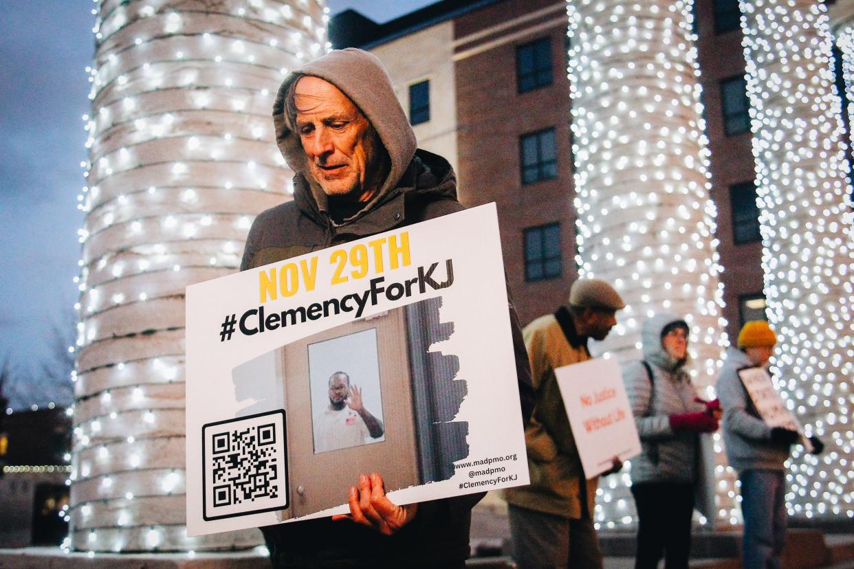 Jeff Stack braves the cold to protest the scheduled execution of Kevin Johnson on Tuesday, Nov. 29, 2022 in downtown Columbia, Mo.