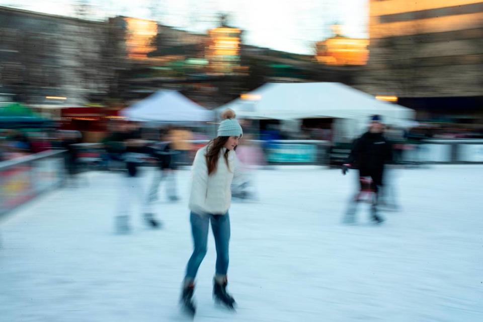 Mallory Sparks skated on the ice rink before the holiday lighting festival.