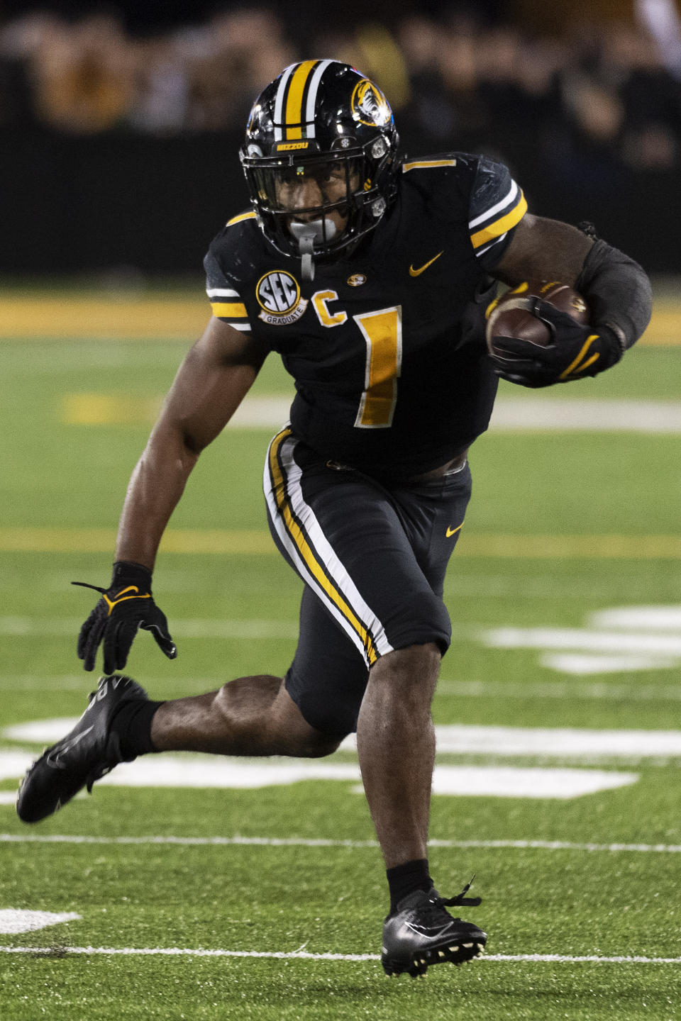 Missouri running back Tyler Badie runs the ball during overtime of an NCAA college football game against Florida, Saturday, Nov. 20, 2021, in Columbia, Mo. (AP Photo/L.G. Patterson)