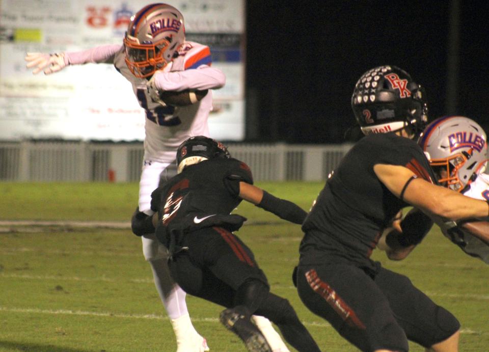 Bishop Kenny defensive back Jayden Harris (6) lunges to tackle Bolles wide receiver Naeem Burroughs (12) during a high school football game on October 28, 2022. [Clayton Freeman/Florida Times-Union]