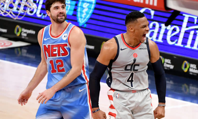 Brooklyn Nets Joe Harris and Washington Wizards Russell Westbrook on the court.