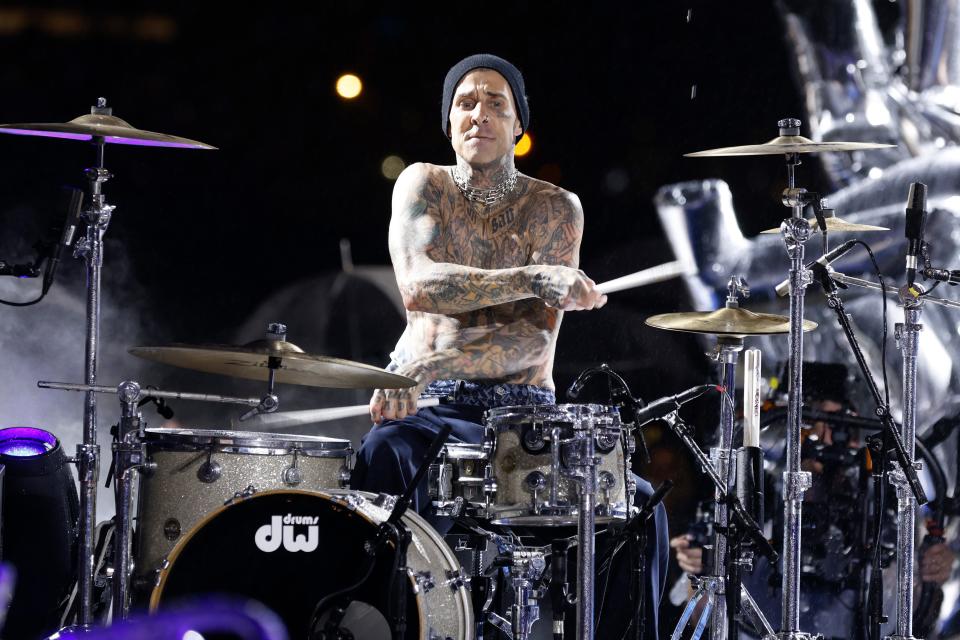 Musician Travis Barker played drums at Tommy Hilfiger's New York Fashion Week show.