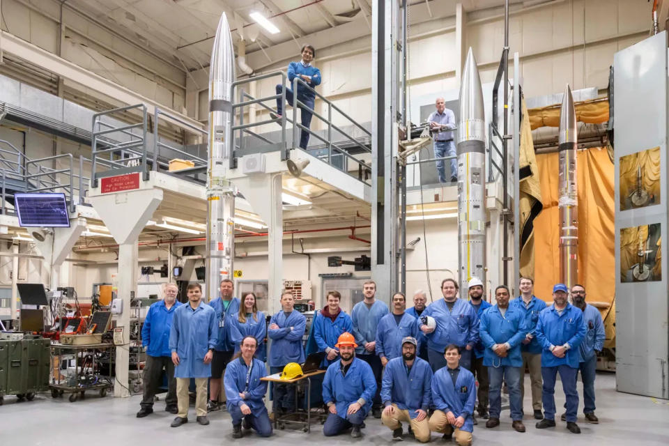 The three sounding rockets can be seen in this photo shortly after the pictured support team successfully assembled them. NASA is launching the rockets on April 8 during the solar eclipse to study how the sudden drop in sunlight affects our upper atmosphere.