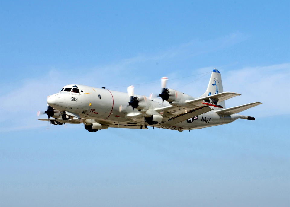 FILE - This Jan. 2003 file photo provided by the U.S. Navy shows a P-3 Orion shortly after takeoff from Naval Air Station North Island, Calif. The U.S. Navy decided that long-range naval aircraft were a more efficient way to search for missing Malaysia Airlines Boeing 777 in such a vast area, so will be relying on P-3 and P-8 planes, while the two destroyers go back to normal duties. (AP Photo/US Navy, Mahlon K. Miller, File)