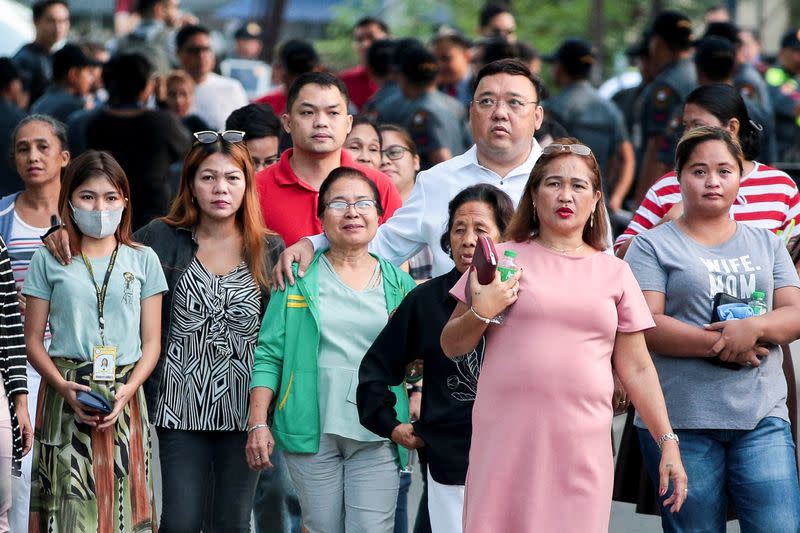 Relatives of the victims of the 2009 Maguindanao Massacre in the southern Philippines arrive at a police headquarters for the promulgation of the case in Taguig City