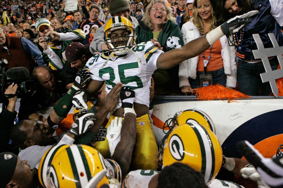 Green Bay Packers wide receiver Greg Jennings celebrates his game-winning 82 yard touchdown reception in overtime.