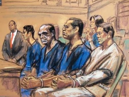 Jeff Yin (2nd L), John Ashe, Francis Lorenzo (2nd R) and Ng Lap Seng (R) along with Sheri Yan (back) are pictured seated in court in New York in this court sketch October 22, 2015. REUTERS/Jane Rosenberg