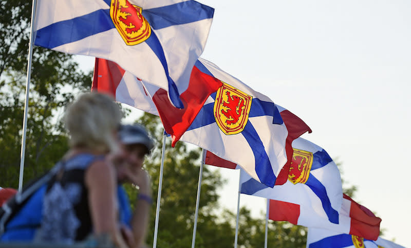 Flags of Nova Scotia and Canada. Photo from Getty Images.