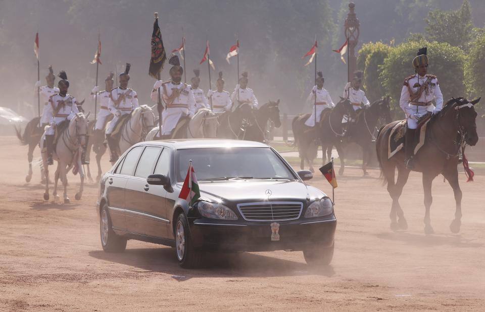 German Chancellor Merkel arrives in her car to attend her ceremonial reception at the forecourt of Indiaâ€™s Rashtrapati Bhavan presidential palace in New Delhi