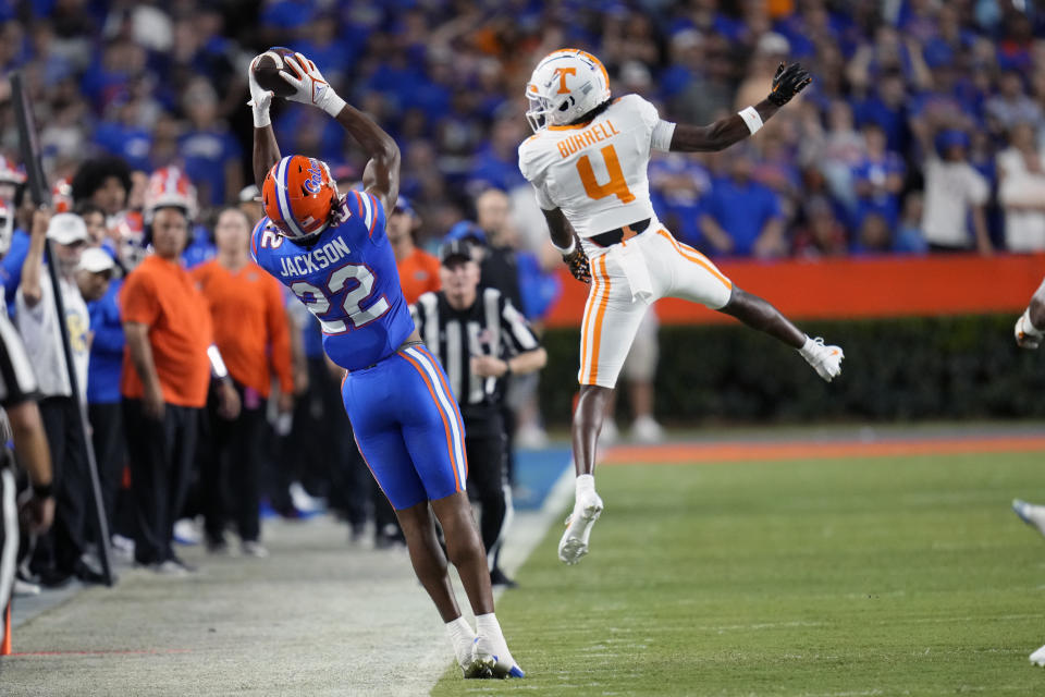Florida wide receiver Kahleil Jackson (22) makes a reception in front of Tennessee defensive back Warren Burrell (4) during the first half of an NCAA college football game, Saturday, Sept. 16, 2023, in Gainesville, Fla. (AP Photo/John Raoux)