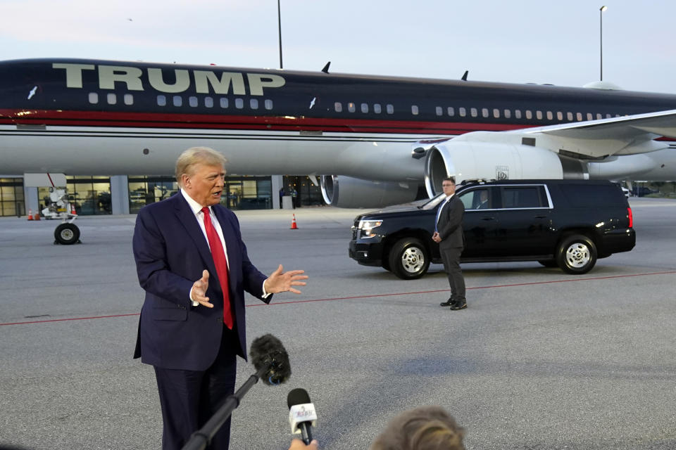 Former President Donald Trump speaks with reporters before departure from Hartsfield-Jackson Atlanta International Airport, Thursday, Aug. 24, 2023, in Atlanta. (AP Photo/Alex Brandon)