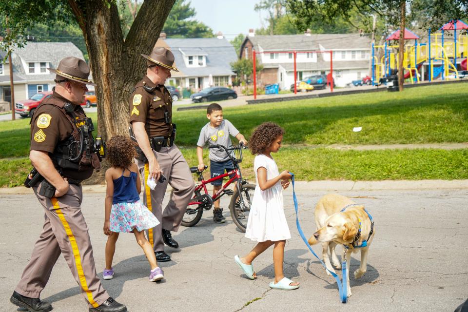 Community members gather in Knollwood for a peace walk on Thursday, June 29, 2023.