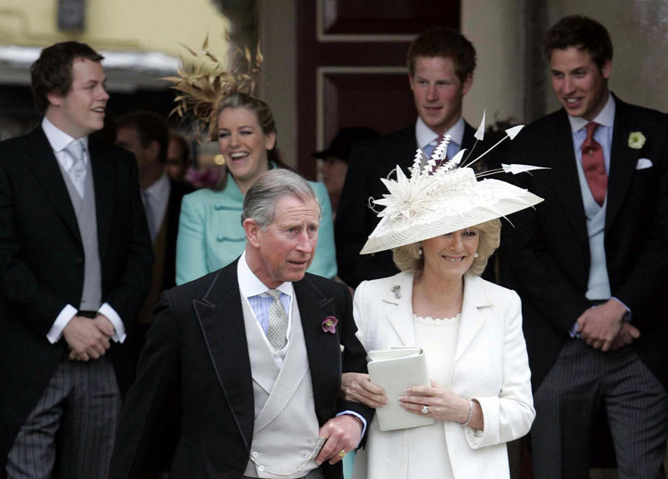 FILE - Britain's Prince Charles, and Camilla, Duchess of Cornwall, leave the Guildhall, Windsor, Saturday, April 9, 2005, following their civil wedding ceremony. The couple will later have their wedding blessed at Windsor Castle's St. George's Chapel. In the background can be seen The Duchess' son Tom Parker-Bowles. left, and daughter Laura Parker-Bowles, and Prince Charles' sons Prince Harry, second right, and Prince William. King Charles III will hope to keep a lid on those tensions when his royally blended family joins as many as 2,800 guests for the new king’s coronation on May 6 at Westminster Abbey. (Peter Tarry, Pool via AP, File)