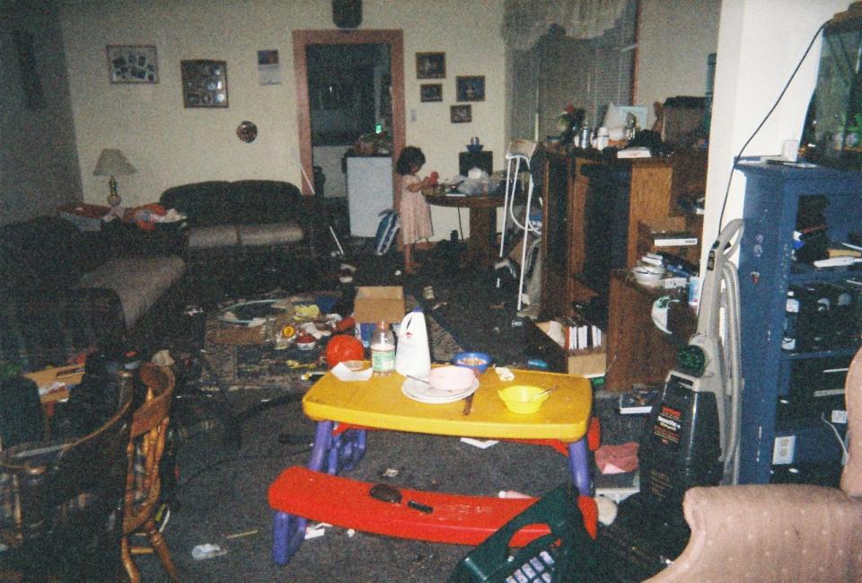 The teenager shared her story on Reddit along with this photo of the lounge room of her home, which had rubbish scattered everywhere.