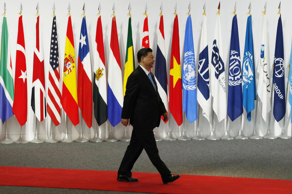 FILE - Chinese President Xi Jinping arrives at the G-20 leaders summit in Osaka, western Japan, on June 28, 2019. After a lengthy absence from major international gatherings, Chinese leader Xi is leaving his country's COVID bubble and venturing abroad next week into a dramatically changed world marked by rising confrontation. Xi will attend the G-20 meeting of industrial and emerging market nations in Indonesia followed by the Asia-Pacific Economic Cooperation summit in Thailand. (Kim Kyung-Hoon/Pool Photo via AP, Pool, File)