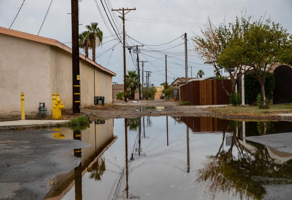 Standing water is seen along Biskra Street after the previous night's storm in Indio, Calif., Saturday, Aug. 19, 2023. 