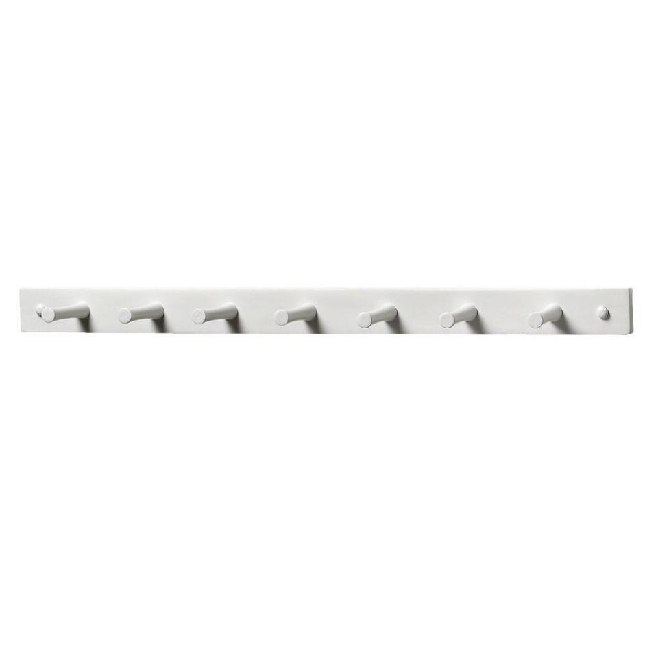 SHOP NOW: 24-inch decorative white 7-peg wall mount wood rack by Spectrum, $14, homedepot.com