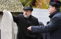 Poland's chief rabbi Michael Schudrich, left, and priest Zbigniew Kasprzyk stand together for prayers for the souls of some 60 Jews murdered by the occupying Nazi German forces during a ceremony marking a memorial to the victims in Wojslawice, Poland, Thursday Oct. 14, 2021. The grave is among many Holocaust graves that still exist across Poland today. In recent years they are being discovered, secured and marked. (AP Photo/Czarek Sokolowski)