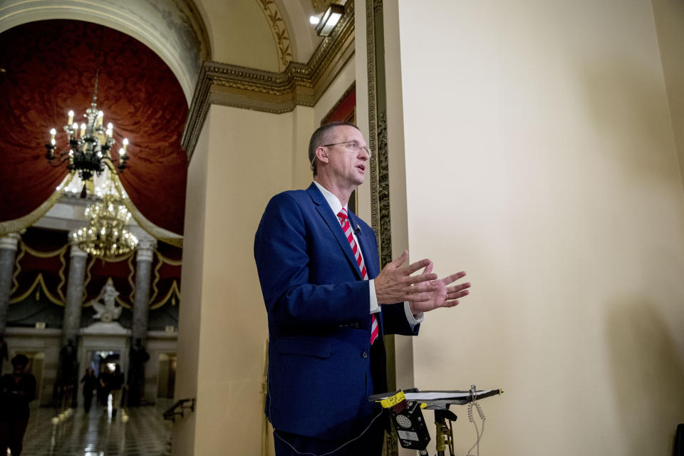 House Judiciary Committee ranking member Rep. Doug Collins, R-Ga., speaks on a television network after House Democrats unveil articles of impeachment against President Donald Trump, abuse of power and obstruction of Congress, Tuesday, Dec. 10, 2019, on Capitol Hill in Washington. (AP Photo/Andrew Harnik)