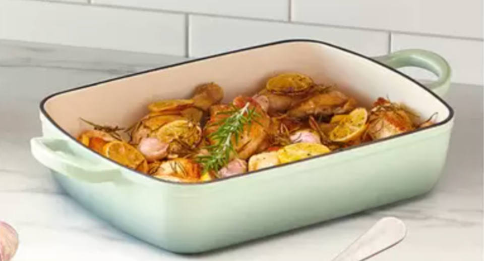 Aldi baking tray filled with roast potatoes and vegetables.
