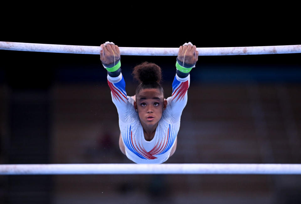 France's Melanie de Jesus dos Santos competes on the uneven bars during the women's gymnastics team event final at the Summer Olympics in Tokyo, Japan on July 27, 2021.<span class="copyright">Marijan Murat—picture alliance via Getty Images</span>