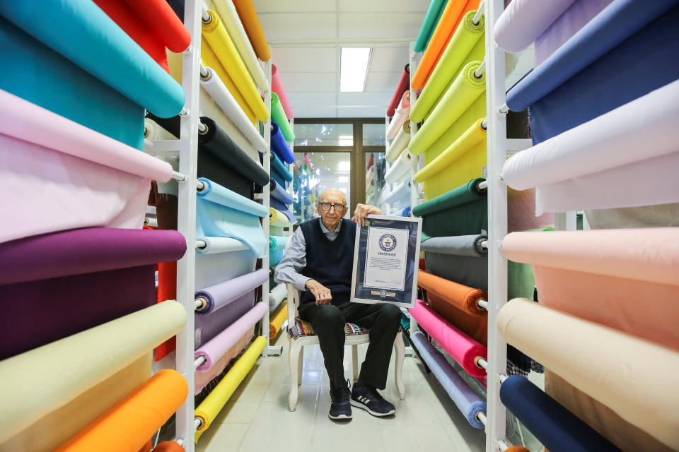 Walter Orthmann, 100, the winner of a Guinness World Record for having the longest career (84 years) at the same company, poses for picture at his company in Brusque, Santa Catarina state, Brazil, April 20, 2022. Picture taken April 20, 2022. REUTERS/Diego Vara