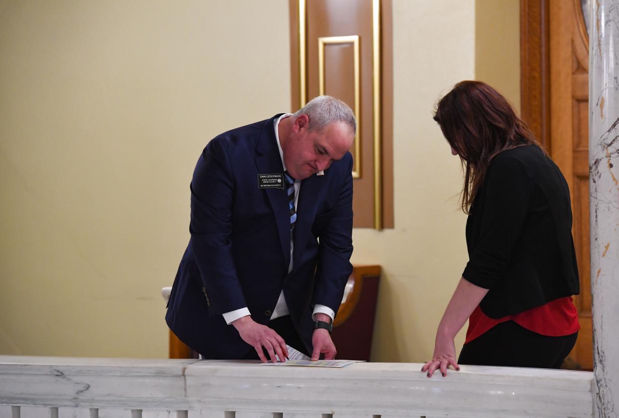 Dan Lederman, state Republican Party chairman, makes edits to a document in the hallway on Tuesday, Jan. 14, at the State Capitol in Pierre.