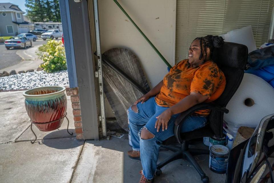 Arlysia Harris said Tuesday that she likes to chill with the garage door open in her parents’ house and listen to music so she doesn’t disturb them inside the home. “I like to be out here because I love old school music – that’s my thing.”