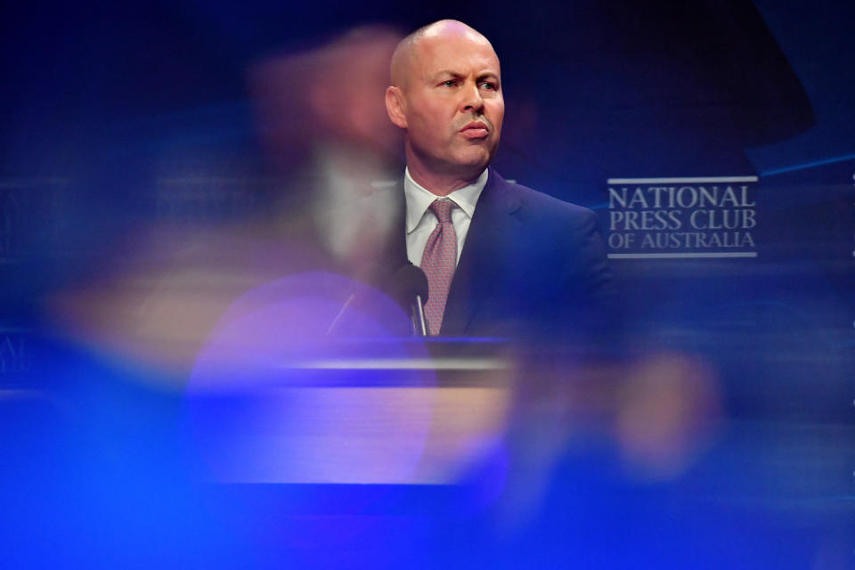 CANBERRA, AUSTRALIA - MAY 12: Federal Treasurer Josh Frydenberg holds a copy of the 2021-2022 Federal Budget before he delivers his budget address at National Press Club, in the Great Hall at Parliament House on May 12, 2021 in Canberra, Australia. The Morrison government's third budget, handed down on Tuesday, has an increased focus on women, with almost $354 million in funding allocated for women's health. Treasurer Josh Frydenberg also outlined more than $10 billion in spending on major infrastructure projects across Australia aimed to help create local jobs and boost productivity in the COVID-affected national economy. Aged care will receive more than $10 billion over the next four years, in direct response to the findings of the Royal Commission into Aged Care Quality and Safety. (Photo by Sam Mooy/Getty Images)