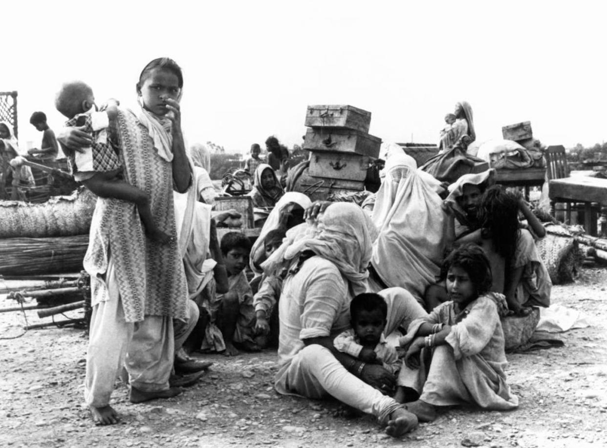 A refugee family that fled to Pakistan after the Partition of British India. <a href="https://www.gettyimages.com/detail/news-photo/famille-r%C3%A9fugi%C3%A9e-dans-un-camp-apr%C3%A8s-la-partition-de-linde-news-photo/833364734?adppopup=true" rel="nofollow noopener" target="_blank" data-ylk="slk:Keystone-France/Gamma-Keystone via Getty Images;elm:context_link;itc:0;sec:content-canvas" class="link ">Keystone-France/Gamma-Keystone via Getty Images</a>