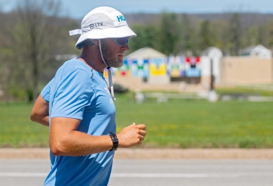 Paul Johnson runs past the Boalsburg Military Museum as he crosses through Centre County on Tuesday, April 16, 2024. Johnson, who is a Penn State alum, is running across the United States from Los Angeles to New York City while raising money for Team RWB.