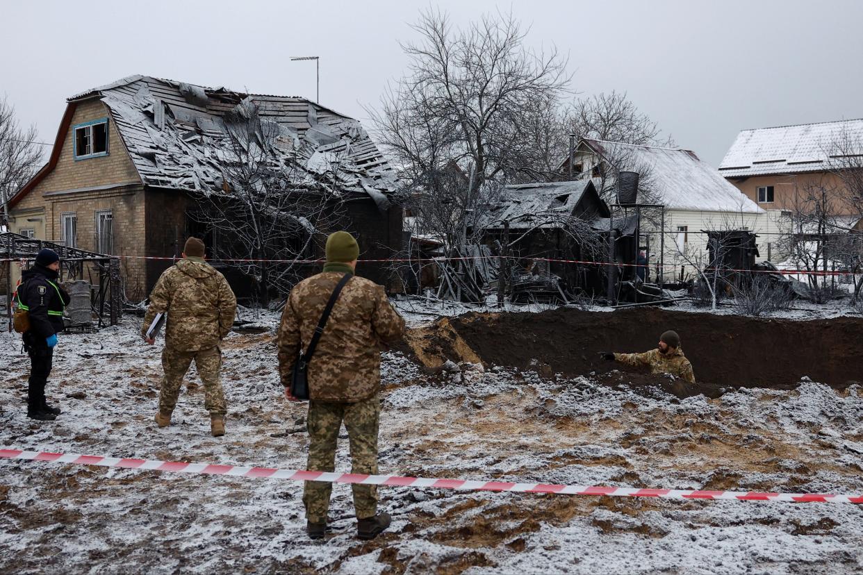 Police officers inspect a site of a Russian missile strike, amid Russia's attack on Ukraine, in Kyiv (REUTERS)