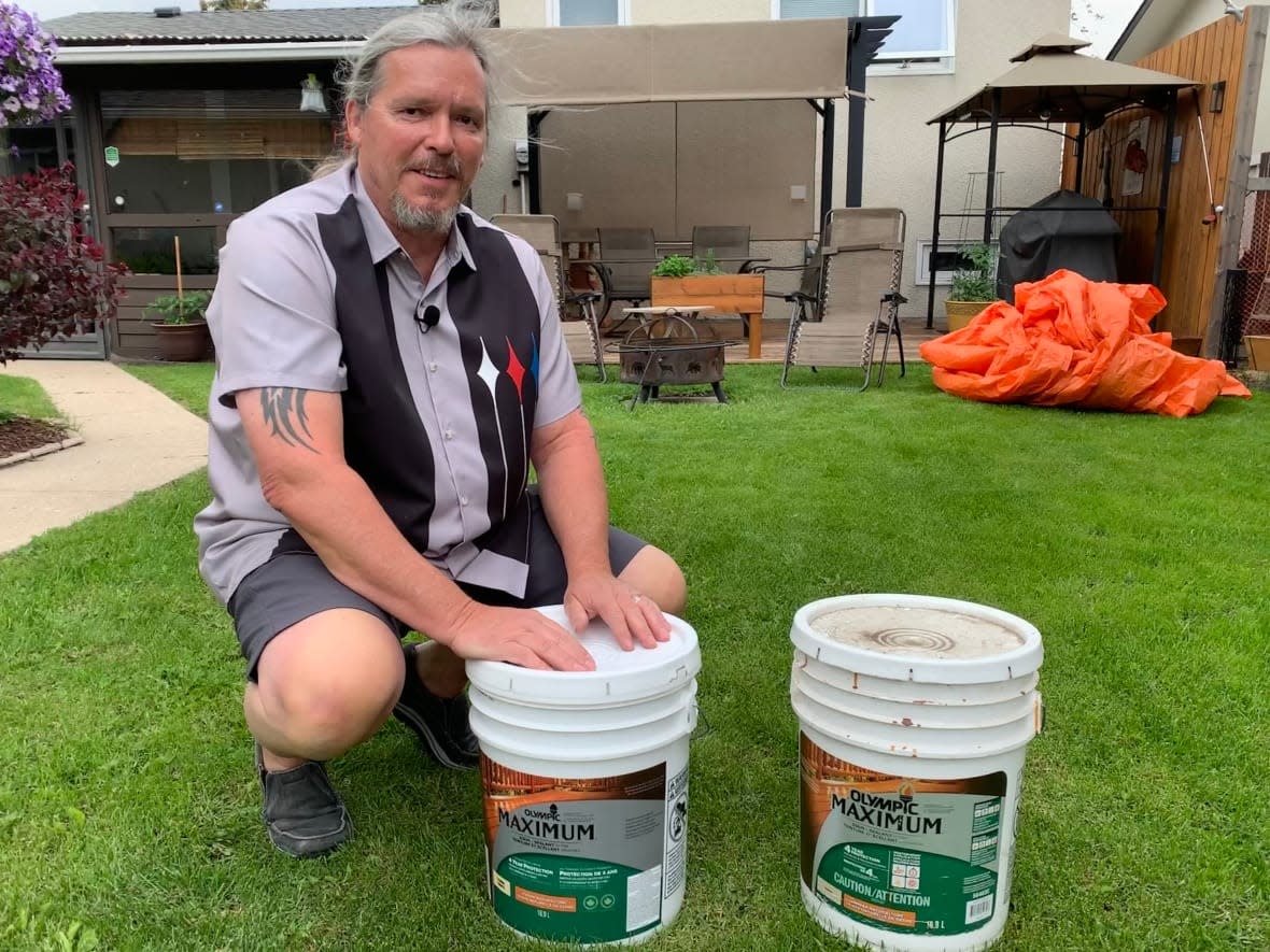 Andreas Mann stained his Edmonton deck in the summer of 2020. A year and a half later, the deck was already peeling. (David Bajer/CBC - image credit)