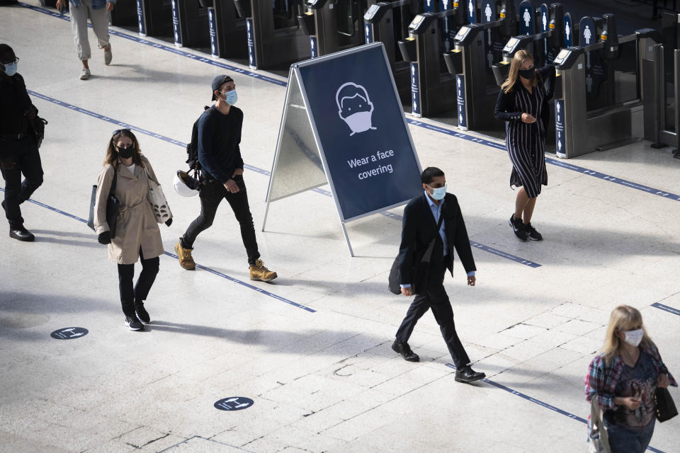 Passengers wearing face masks at Waterloo station in London as face coverings become mandatory on public transport in England with the easing of further lockdown restrictions during the coronavirus pandemic.