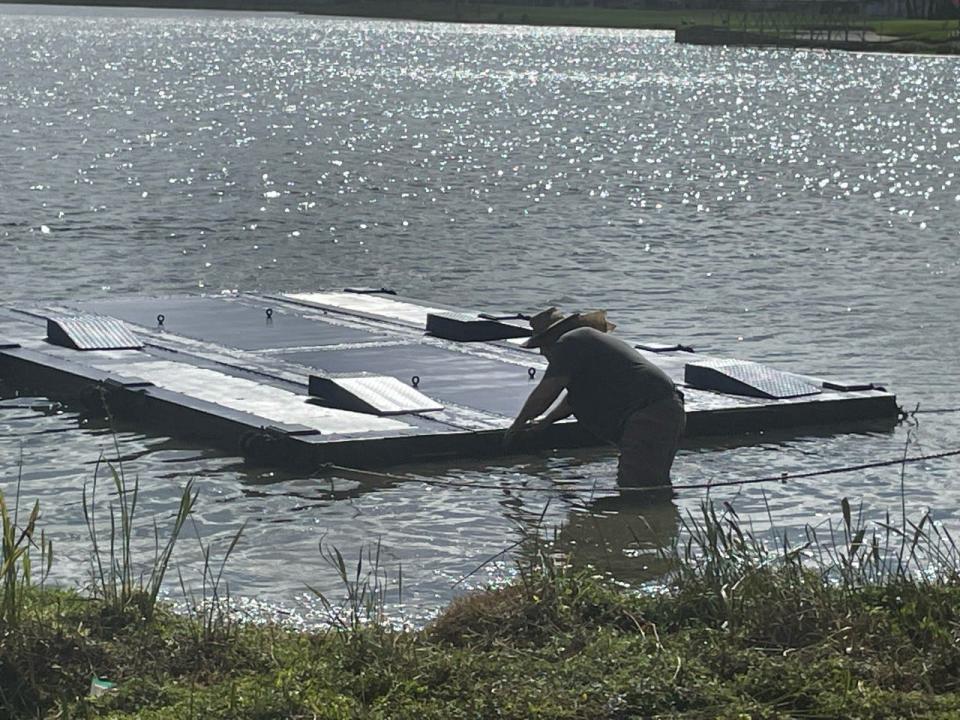 John Johnson working on the platform used to float a car Thursday before the 2023 Honda Classic at PGA National in Palm Beach Gardens.
(Photo: Tom D'Angelo)