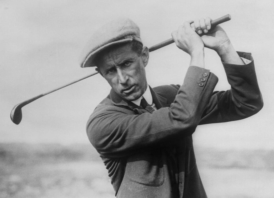 Jim Barnes swinging golf club